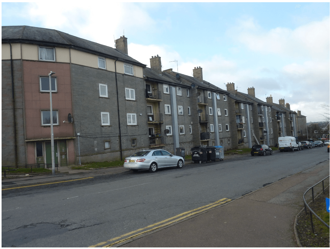 Long shot of row of flats.