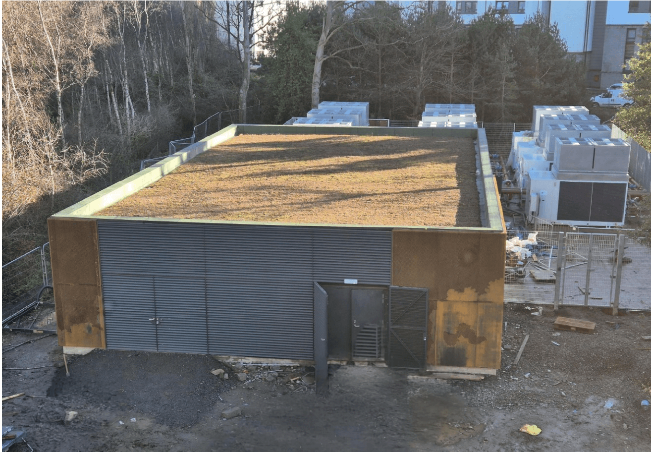 Energy centre at Western Villages site with start of planted green roof and air source heat pumps to the rear.