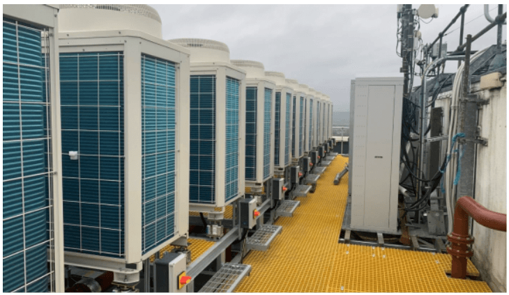 Air source heat pumps on rood of high rise flats.