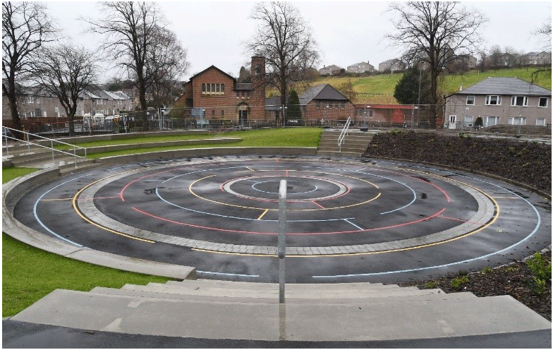 The amphitheatre ad Croftfoot primary school showing a circular playground with colourful lines